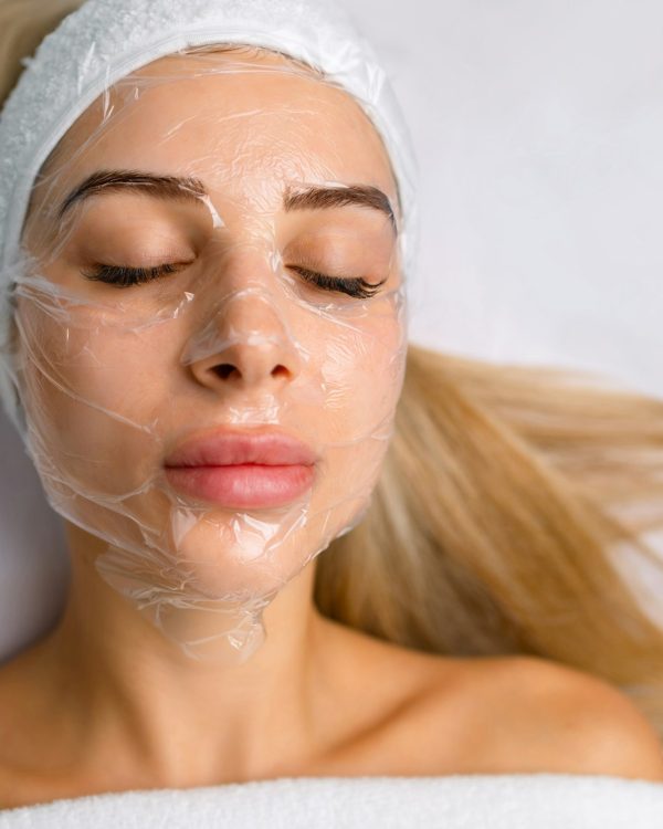 a-woman-s-face-covered-with-a-film-in-a-cosmetology-office-skin-problems-cleaning-the-skin-of-the